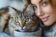 © DKPhoto - A close-up of a woman with a cat, capturing a warm and cozy moment. The intimate bond between the woman and her feline companion is the highlight of the image.