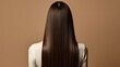 © Tanakorn - Woman with Long Straight Brown Hair Back View, Long Hairstyle, Healthy Hair, Perfect Hair, Studio Shot, Beige Background