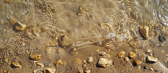 Sticker - Close up detailed view of textured wet sand on the beach suitable for a copy space image