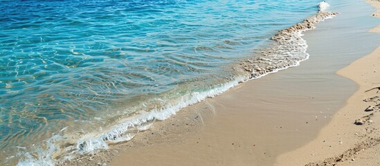 Canvas Print - Sandy beach on the Mediterranean coast with empty clear sand providing a summer background and space for copy in the image