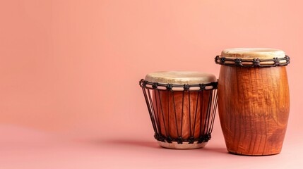 A minimalist bongo drums against a solid blush background