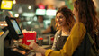 © Luba - Fast food cashier serving cheerful customers