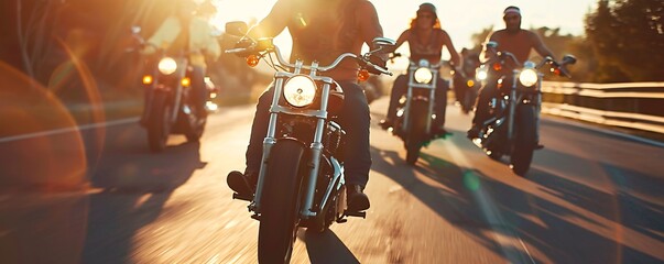 Wall Mural - Bikers enjoying a sunset ride on powerful motorcycles along a scenic road