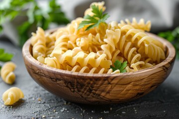 Poster - A wooden bowl filled with pasta and parsley