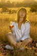 © Олег Мальшаков - Beautiful young girl with a glass of wine on a picnic