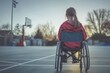 © JCIPhoto - A girl in a wheelchair sits in a basketball court