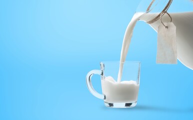 Poster - Pouring tasty white fresh milk in glass