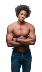 Canvas Print - Afro american shirtless man showing nude body over isolated background skeptic and nervous, disapproving expression on face with crossed arms. Negative person.