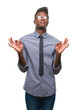 © Krakenimages.com - Young african american business man over isolated background relax and smiling with eyes closed doing meditation gesture with fingers. Yoga concept.
