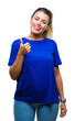 © Krakenimages.com - Young beautiful woman wearing casual blue t-shirt over isolated background doing happy thumbs up gesture with hand. Approving expression looking at the camera with showing success.