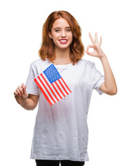 Canvas Print - Young beautiful woman holding flag of america over isolated background doing ok sign with fingers, excellent symbol