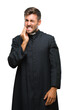 © Krakenimages.com - Young catholic christian priest man over isolated background touching mouth with hand with painful expression because of toothache or dental illness on teeth. Dentist concept.