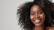 © Johannes - Studio portrait of a beautiful African American woman with clean healthy skin and long shaggy hairstyle smiling and cheerful isolated on transparent png background.