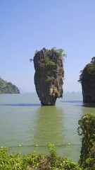 Sticker - Ko Tapu Island in Phang Nga Bay, Thailand. Iconic limestone rock formation. Famous tourist destination. - Vertical