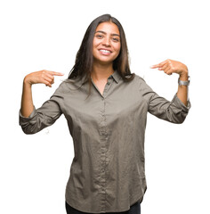 Sticker - Young beautiful arab woman over isolated background looking confident with smile on face, pointing oneself with fingers proud and happy.