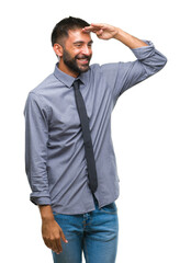 Canvas Print - Adult hispanic business man over isolated background very happy and smiling looking far away with hand over head. Searching concept.