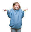 © Krakenimages.com - Young beautiful girl wearing winter sweater over isolated background clueless and confused expression with arms and hands raised. Doubt concept.