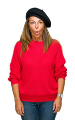 Sticker - Middle age adult woman wearing fashion beret over isolated background afraid and shocked with surprise expression, fear and excited face.