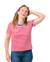 Poster - Beautiful middle age woman wearing casual stripes t-shirt over isolated background Smiling confident touching hair with hand up gesture, posing attractive