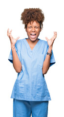 Wall Mural - Young african american doctor woman over isolated background celebrating mad and crazy for success with arms raised and closed eyes screaming excited. Winner concept