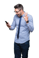 Canvas Print - Young business man using smartphone over isolated background very happy and excited, winner expression celebrating victory screaming with big smile and raised hands