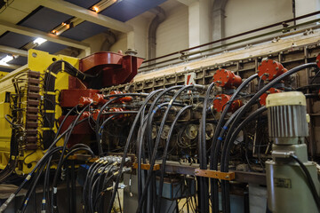 Industrial machine part. Connected high voltage cables, voltmeters and pipes