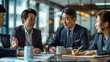 © Катерина Євтехова - a group of Japanese financial professionals in a corporate office, analyzing data, discussing strategies, and interacting with clients, Families in Japan, Japanese finance, everyda