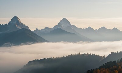 Wall Mural - mountain range enveloped in fog, with peaks just visible through the mist.