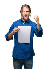 Sticker - Young handsome man with long hair over isolated background holding blank paper annoyed and frustrated shouting with anger, crazy and yelling with raised hand, anger concept