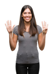 Poster - Young beautiful hispanic woman showing and pointing up with fingers number nine while smiling confident and happy.