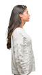 © Krakenimages.com - Young beautiful arab woman wearing winter sweater over isolated background looking to side, relax profile pose with natural face with confident smile.