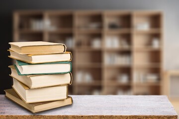 Wall Mural - stack of books in library on wooden table