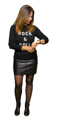 Sticker - Beautiful middle age woman wearing rock and roll sweater Checking the time on wrist watch, relaxed and confident