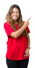 Poster - Young beautiful brunette woman wearing red t-shirt over isolated background cheerful with a smile of face pointing with hand and finger up to the side with happy and natural expression on face