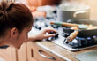 © Hira/peopleimages.com - Woman, cooking and check temperature on stove in kitchen with nutrition, ingredients and heat for meal prep in home. Person, pan and pot with flame, gas and change for food, health and diet at lunch