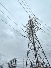 Electricity transmission tower on a cloudy day.