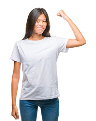 Sticker - Young asian woman over isolated background showing arms muscles smiling proud. Fitness concept.