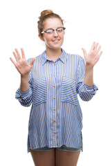 Sticker - Young blonde business woman showing and pointing up with fingers number ten while smiling confident and happy.