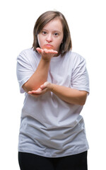 Poster - Young adult woman with down syndrome over isolated background looking at the camera blowing a kiss with hand on air being lovely and sexy. Love expression.