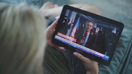 Poster - close up of caucasian woman watching breaking news broadcast about us election day using tablet comp
