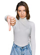 © Krakenimages.com - Young caucasian girl wearing casual clothes looking unhappy and angry showing rejection and negative with thumbs down gesture. bad expression.