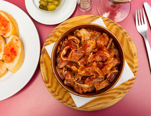 Wall Mural - Galician dish of stewed pigs ear with red pepper and potatoes