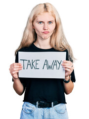 Poster - Young caucasian woman holding banner with take away message skeptic and nervous, frowning upset because of problem. negative person.