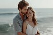 © InfiniteStudio - Romantic couple embracing on beach at sunrise, love concept