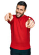 © Krakenimages.com - Young hispanic man wearing casual clothes pointing to you and the camera with fingers, smiling positive and cheerful