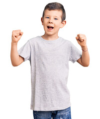 Poster - Cute blond kid wearing casual clothes screaming proud, celebrating victory and success very excited with raised arms