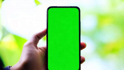 Poster - hand holding smartphone showing green screen mobile app advertisement and excited