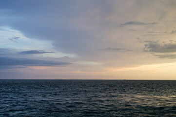 Wall Mural - sun setting over the gulf of mexico from the point of view of a viewer on a boat.