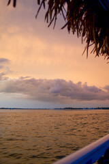 Wall Mural - sun setting over the gulf of mexico from the point of view of a viewer on a boat.