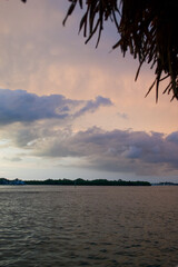 Wall Mural - sun setting over the gulf of mexico from the point of view of a viewer on a boat.